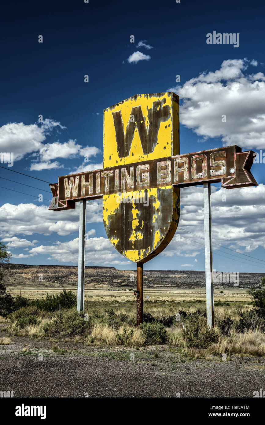 Vintage Whiting Bros. sign above a removed gas station on historic Route 66 in New Mexico. Stock Photo
