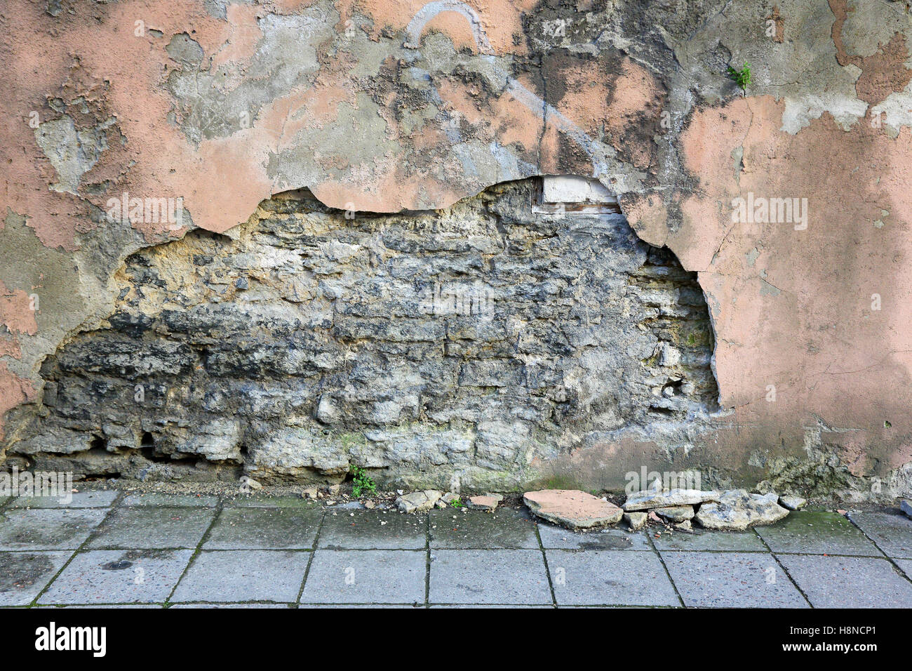 crumbling plaster on the wall of an old house Stock Photo Alamy