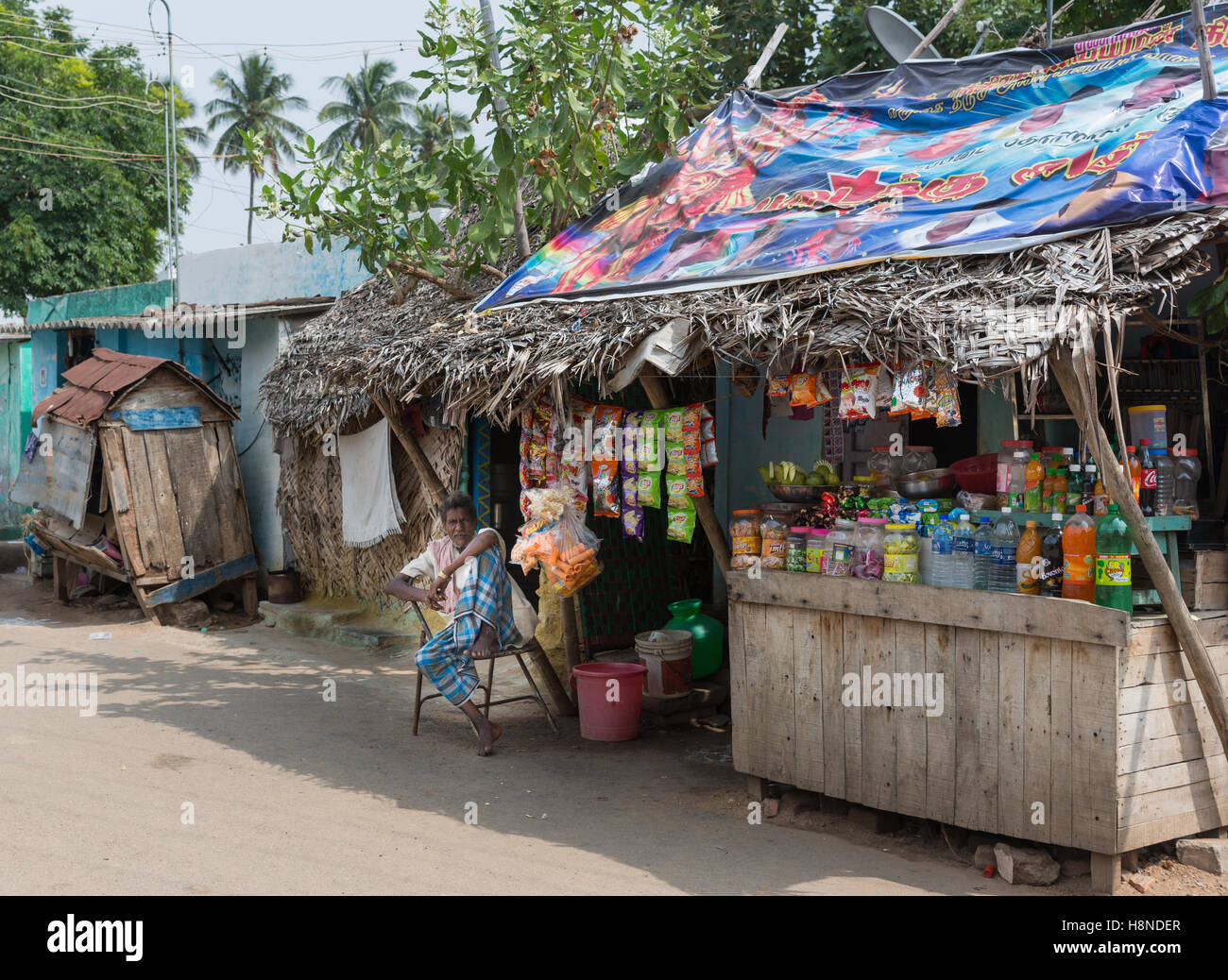 Retailer with ramshackle booth along the street. Stock Photo