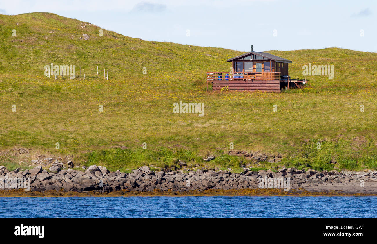 Single house on an small island at the westcoast of Iceland Stock Photo