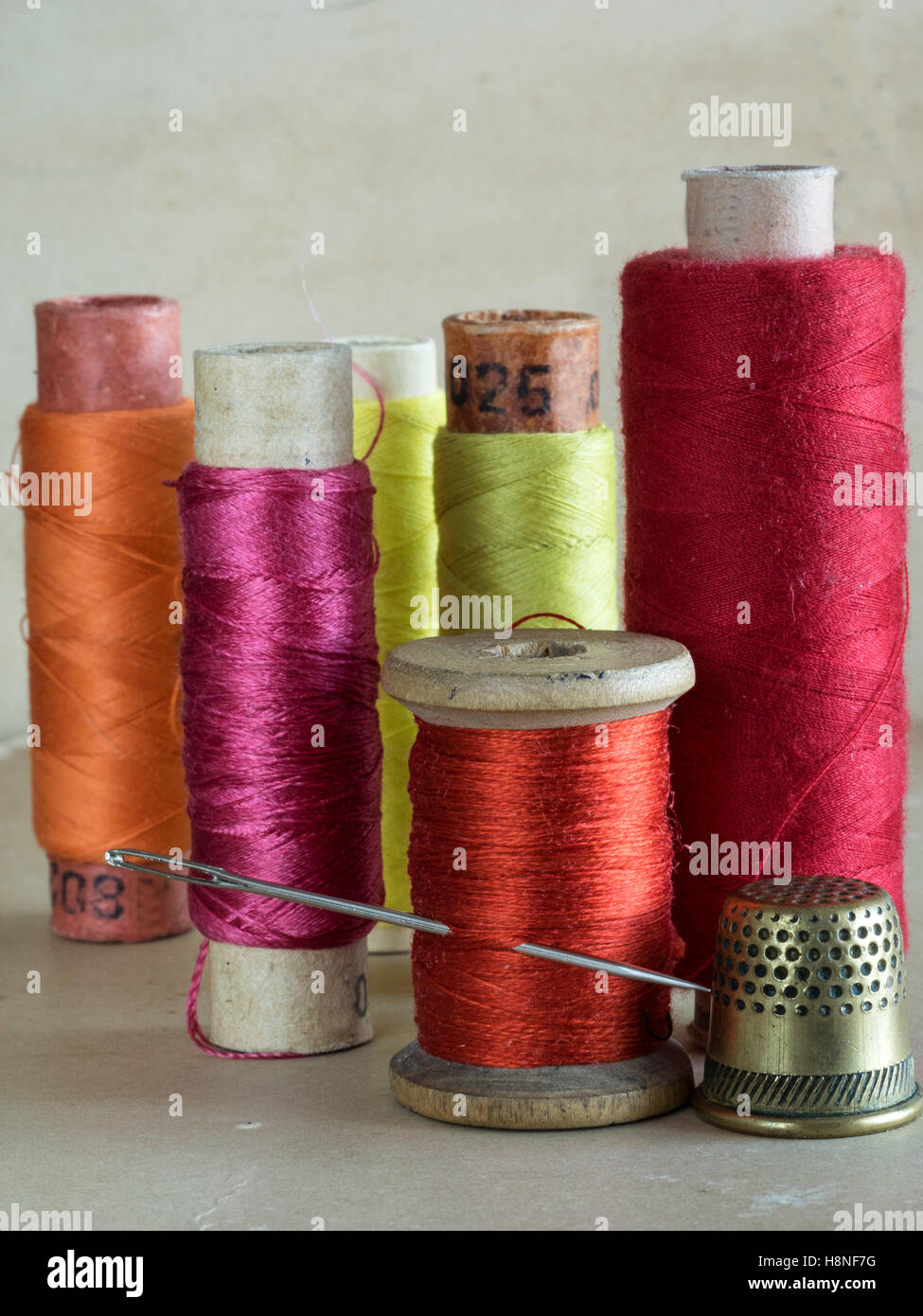 threads for sewing with needle and thimble Stock Photo