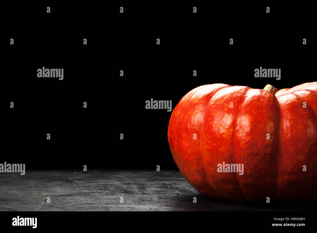Large pumpkin on black Stock Photo - Alamy