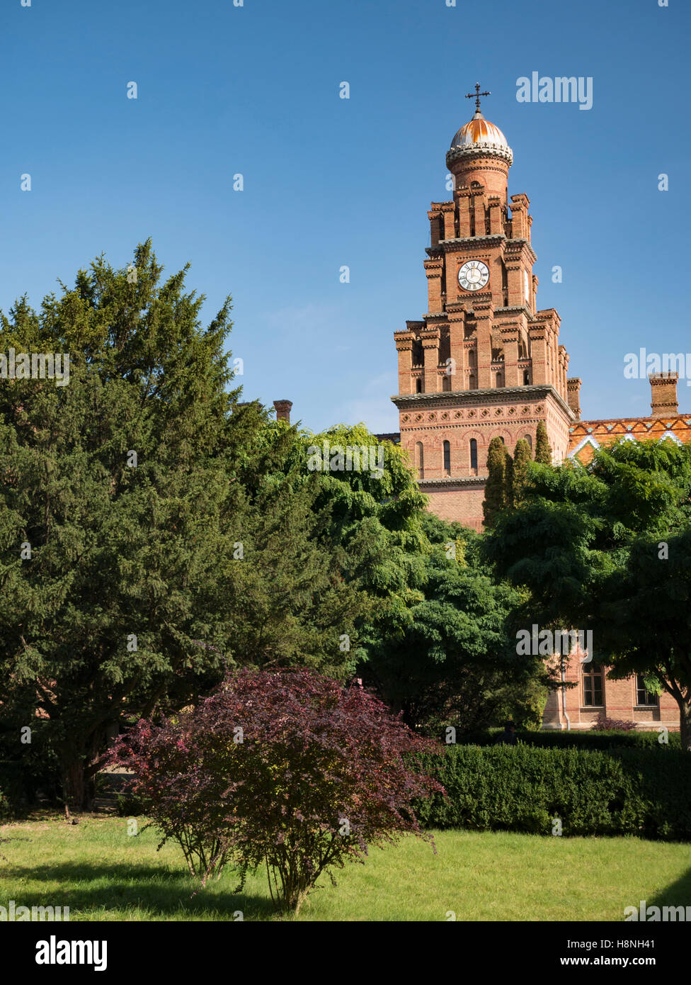 Main tower of Chernivtsi National University in Chernivtsi Ukraine with autumnal trees Stock Photo