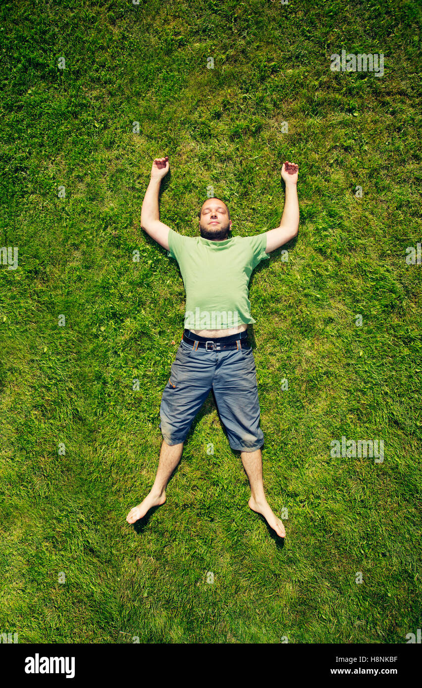 Adult lying in the grass hires stock photography and images Alamy