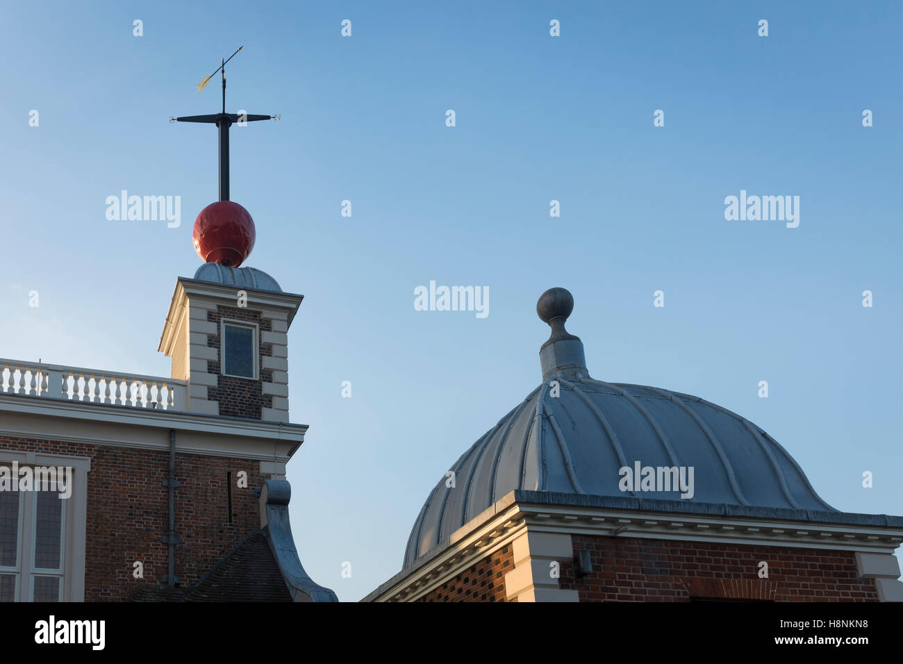 The red 'time ball' and weathervane on top of Flamstead House, part of the Royal Observatory at Greenwich. Stock Photo