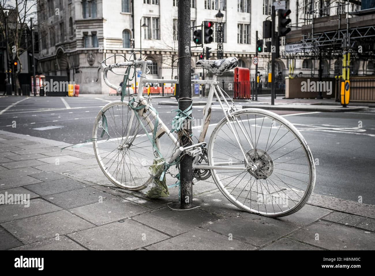 A 'ghost bike' as a memorial to a killed or severely injured cylist at the junction of Vernon Place and Southampton Row, London. Stock Photo