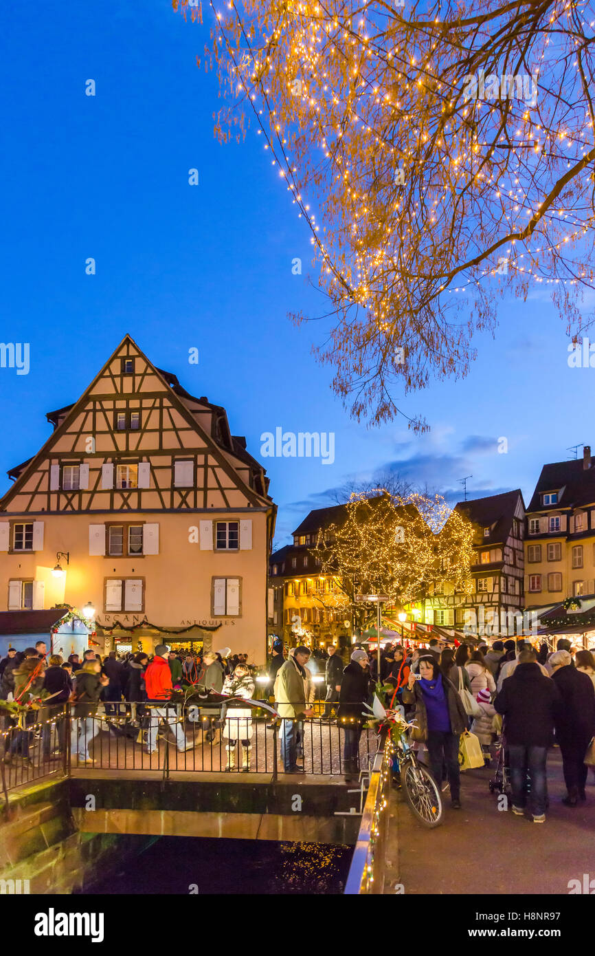 Historic Christmas market  in the center of Colmar at dusk, wine route, Alsace, Haut-Rhin, France Stock Photo