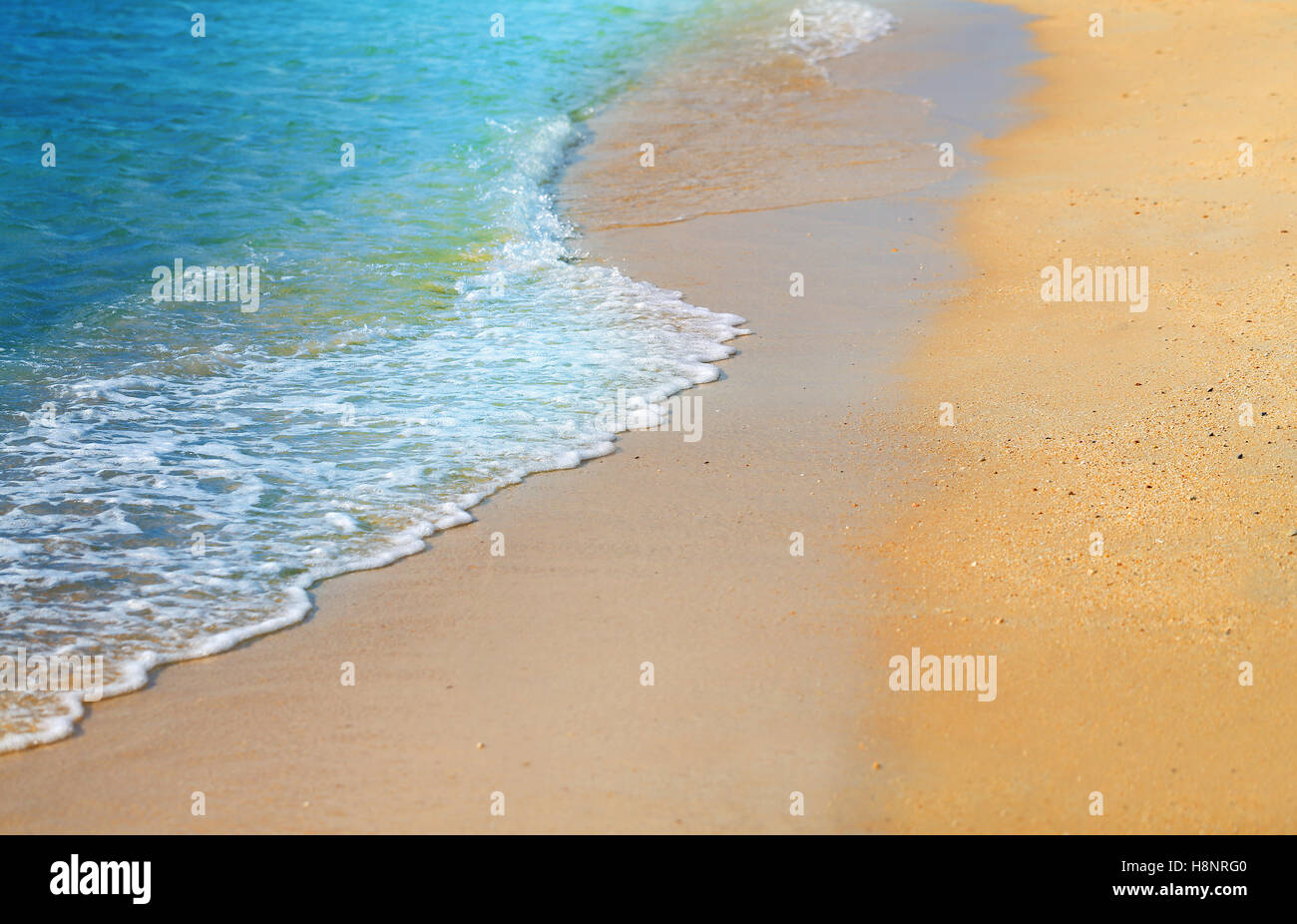 Beautiful waves on the yellow sea sand photographed in close-up Stock Photo