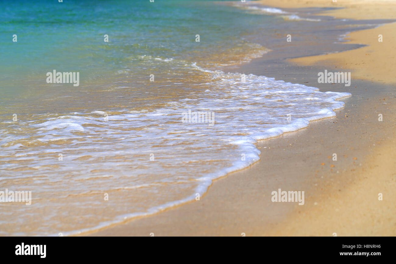 Beautiful waves on the yellow sea sand photographed in close-up Stock Photo