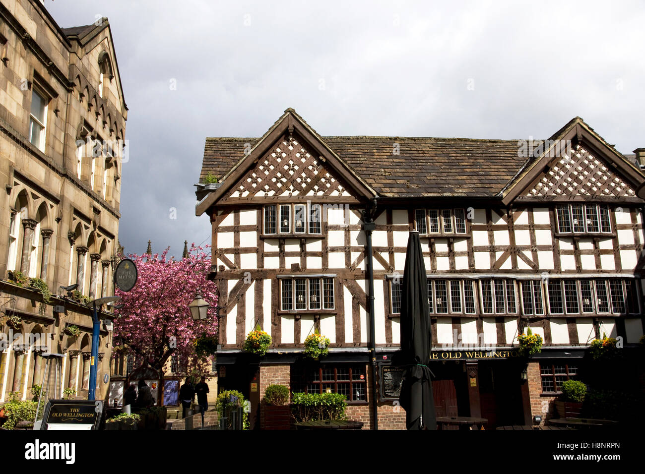 Old Wellington Inn  (+ Mitre Bar - Left), Cathedral Gates / Shambles Square, City Centre, Manchester, UK Stock Photo