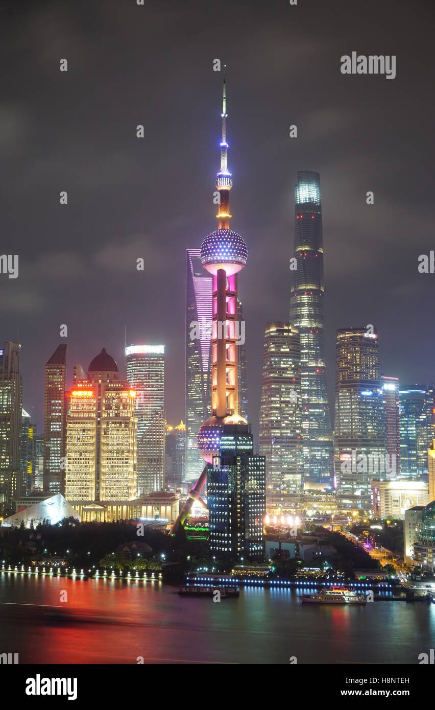 A night view of the modern Pudong skyline across the Bund in Shanghai ...