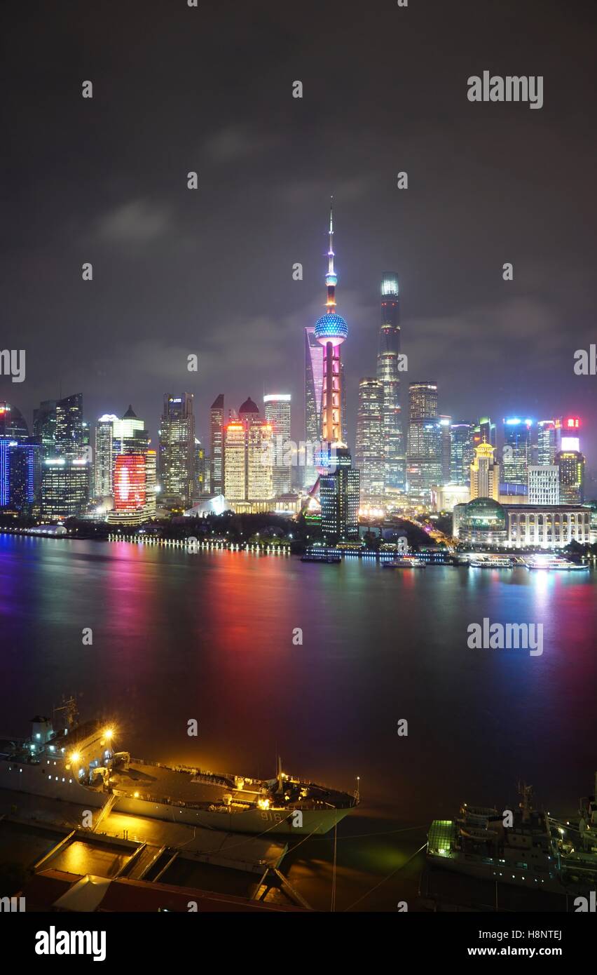 A night view of the modern Pudong skyline across the Bund in Shanghai ...
