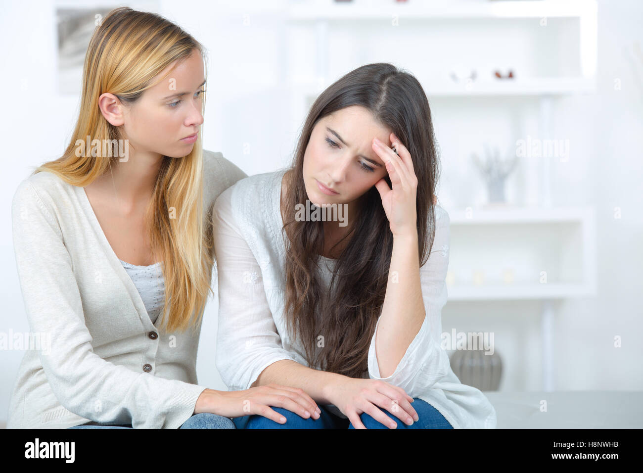 teen girl consoling her sad friend Stock Photo