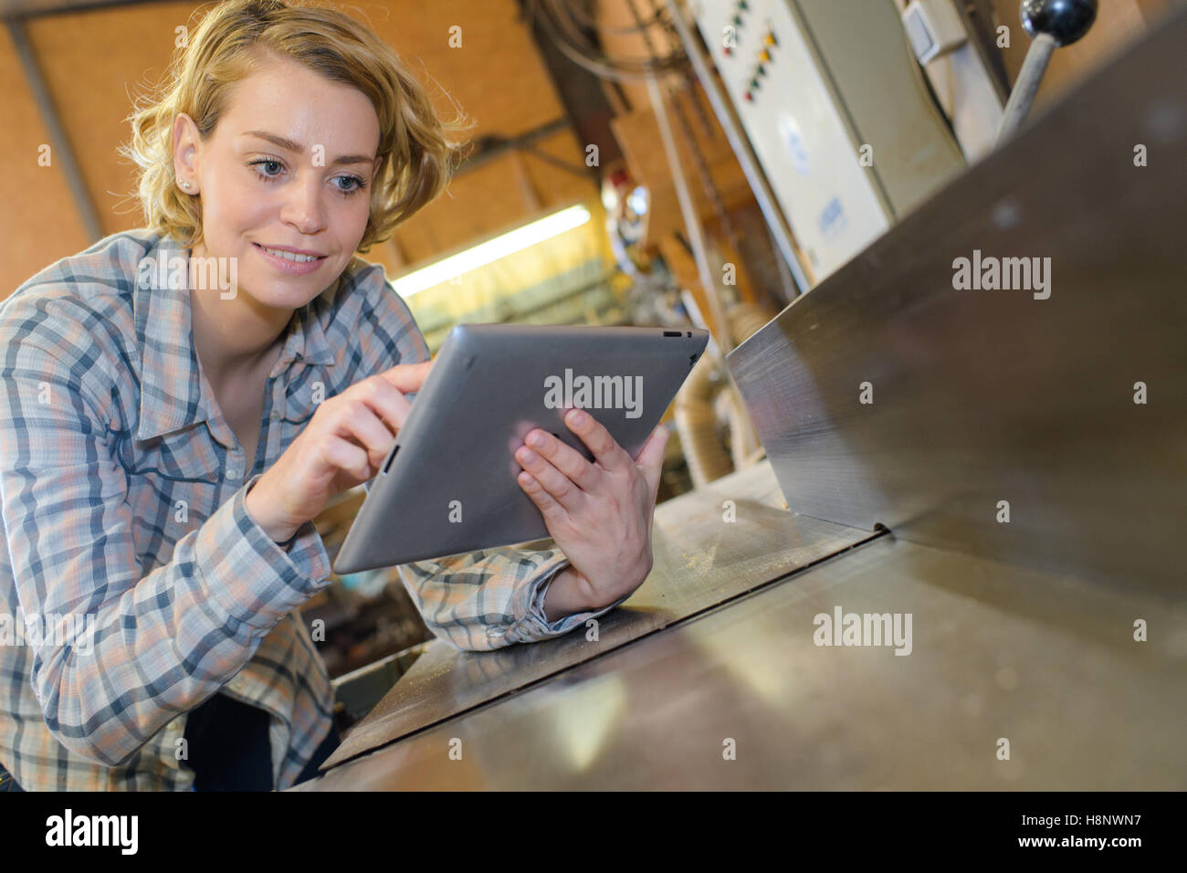 Lady using touchscreen tablet Stock Photo - Alamy