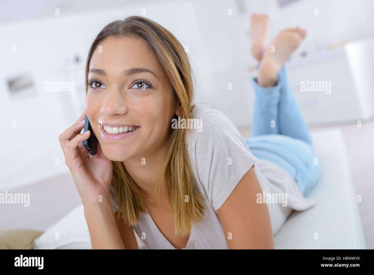 Child laying down on sofa hi-res stock photography and images - Alamy