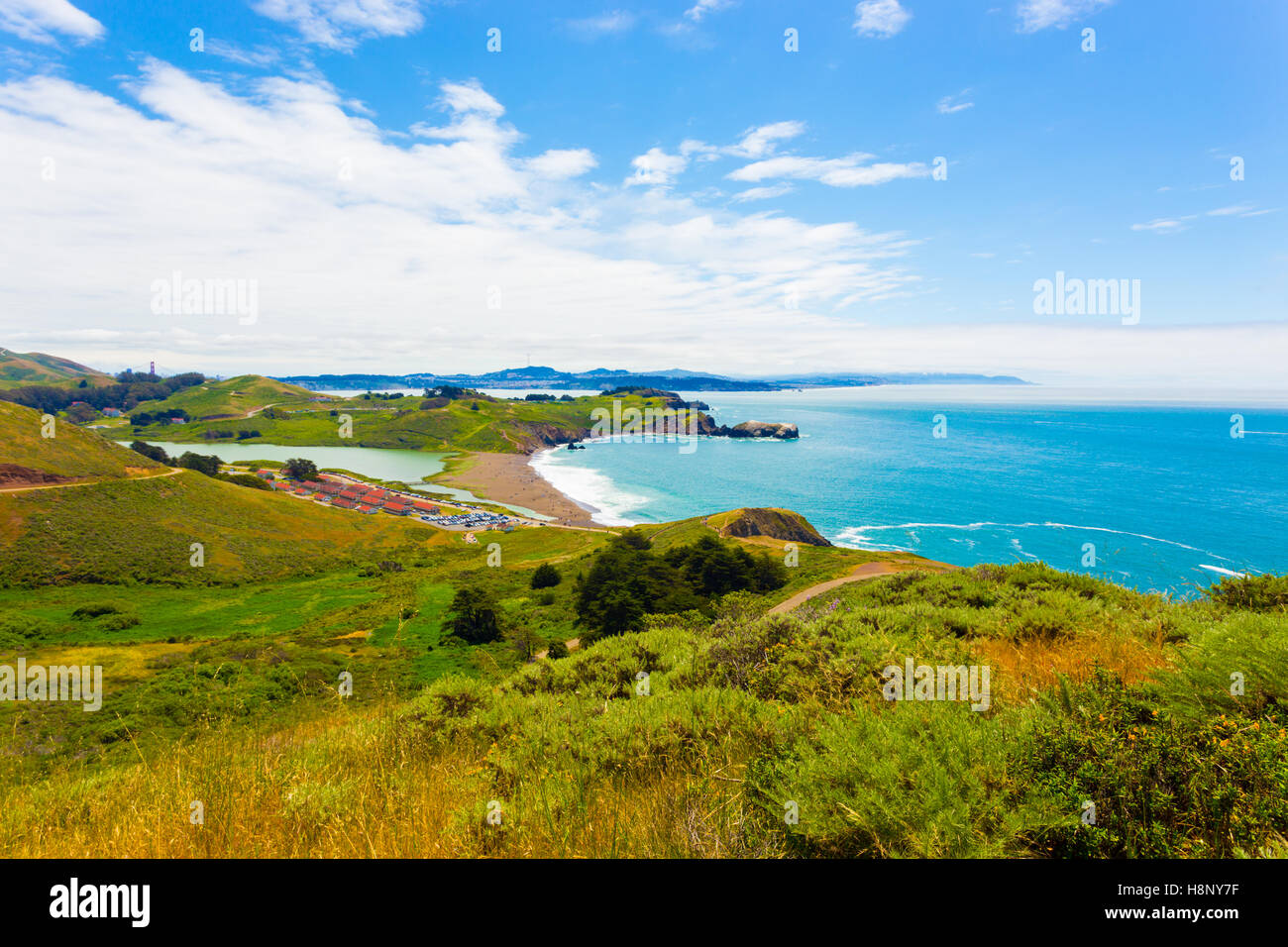 San Francisco in distant background seen from atop the Marin Headlands above Fort Cronkhite and Rodeo Beach along the coast Stock Photo