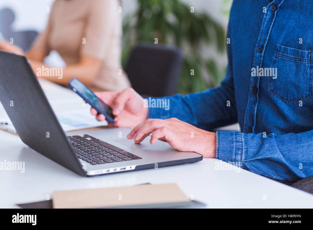 Man and Woman working in office Stock Photo
