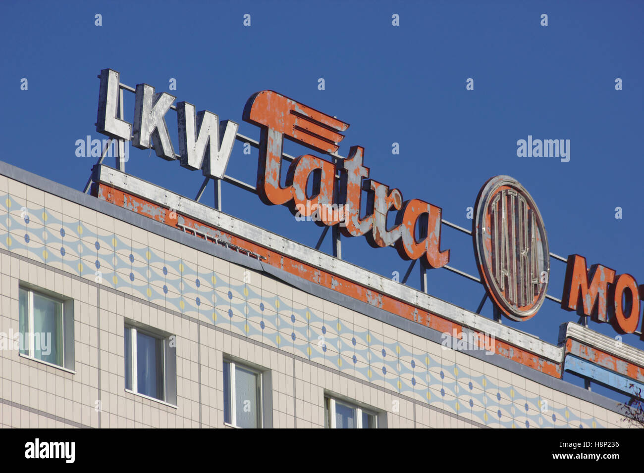 LKW Tartra Mokokov sign, DDR era Plattenbau on Karl-Marx-Allee, Berlin Stock Photo