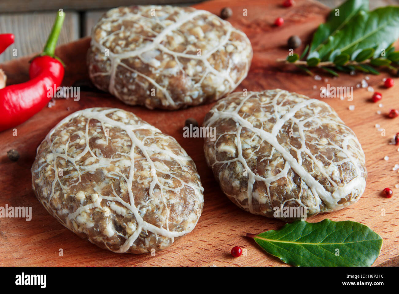 Caul-Fat Meatballs raw burger cutlet handmade on desk Stock Photo