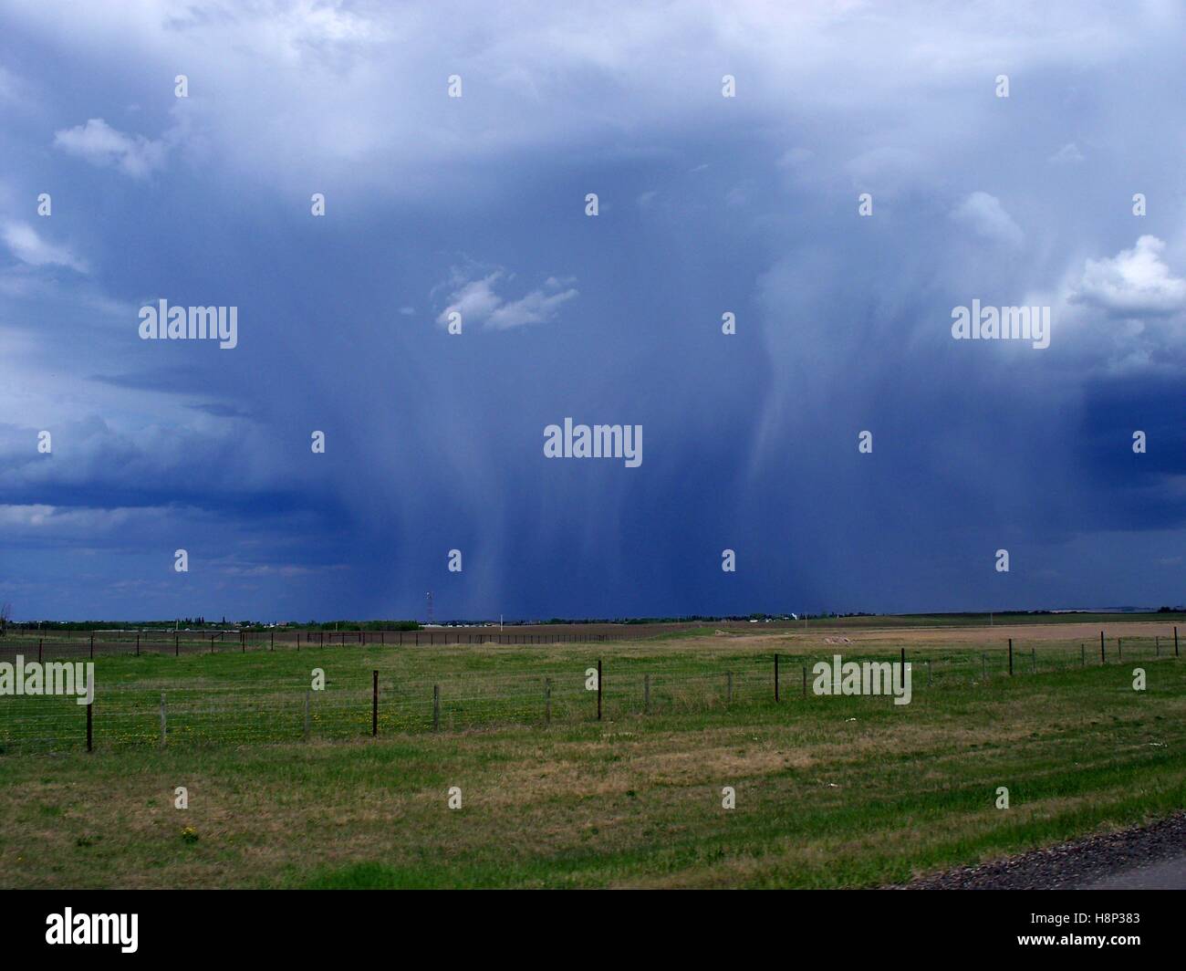 Watching A Storm From Afar in Alberta, Canada Stock Photo