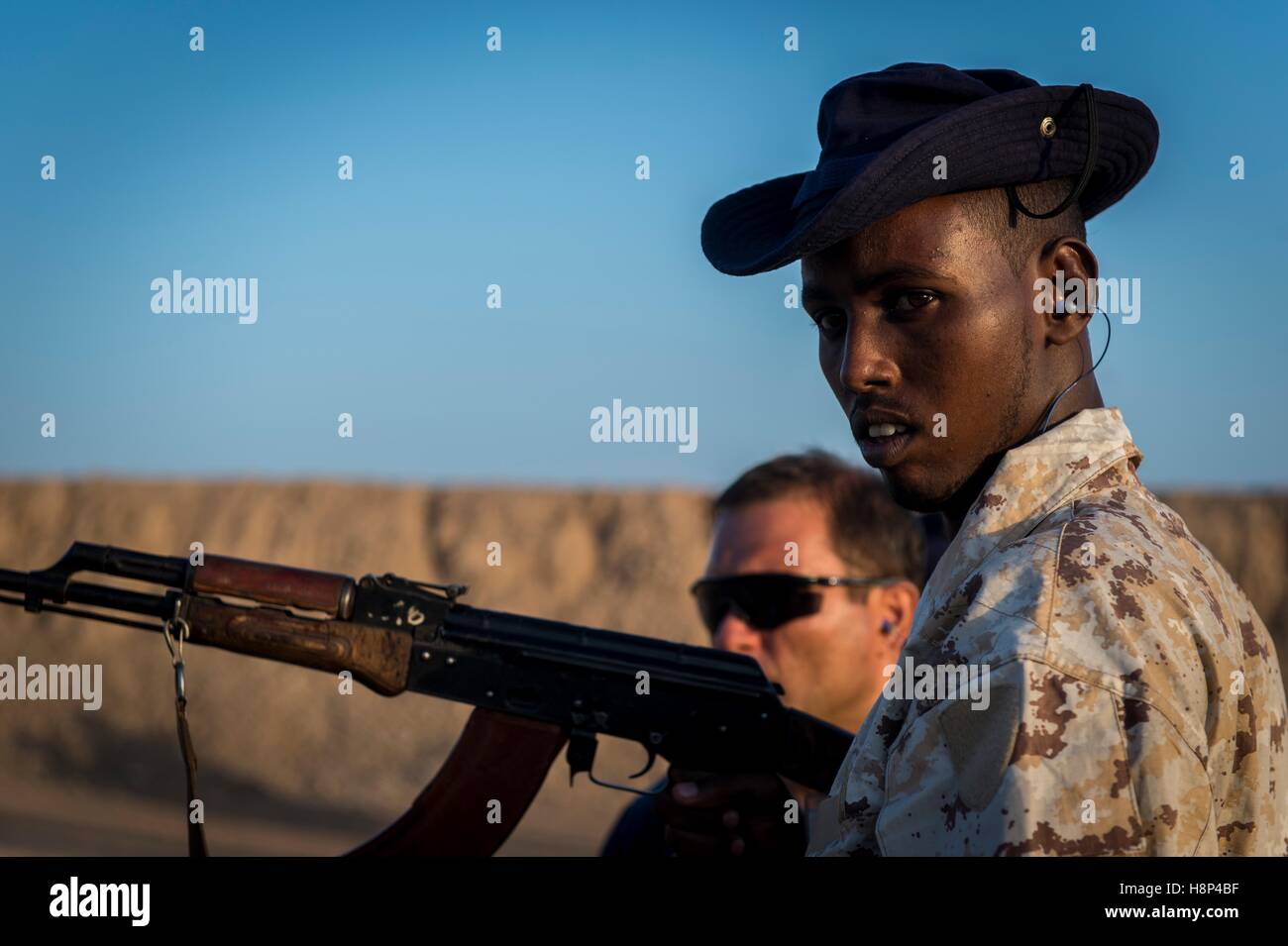 Carabinieri and Somalian Police Force officers train at a shooting range during the MAIDIT Somalia 6 training mission October 30, 2016 in Djibouti. Stock Photo