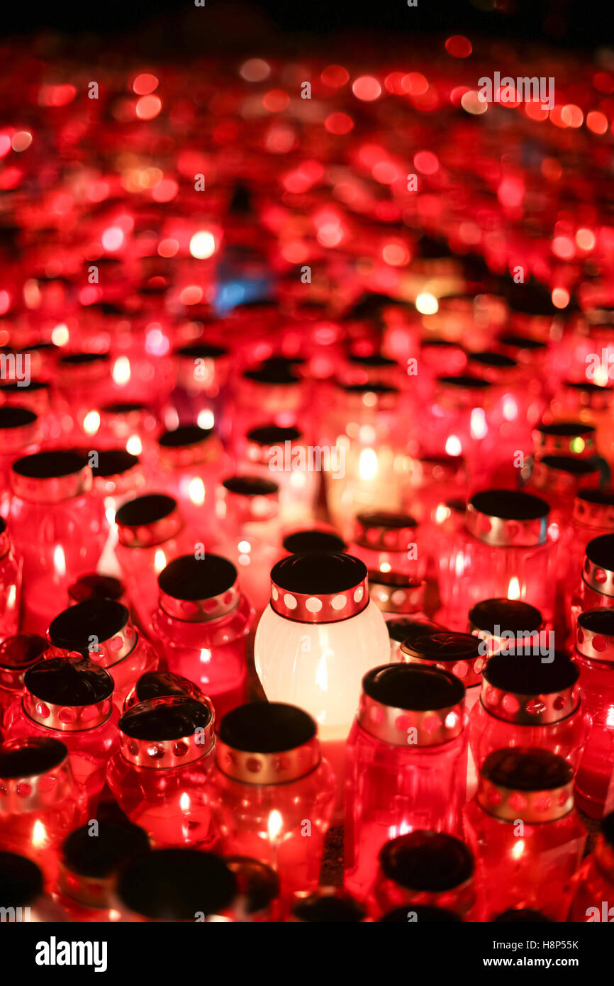 A night view of burning candles for the deceased family members and