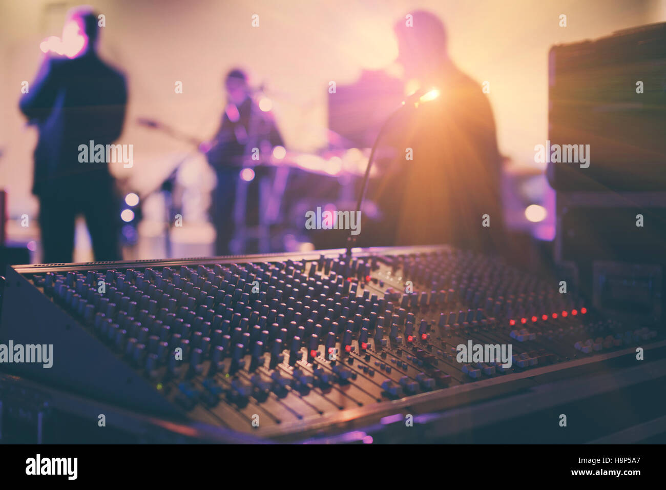 Soundman working on the mixing console in concert hall. Stock Photo