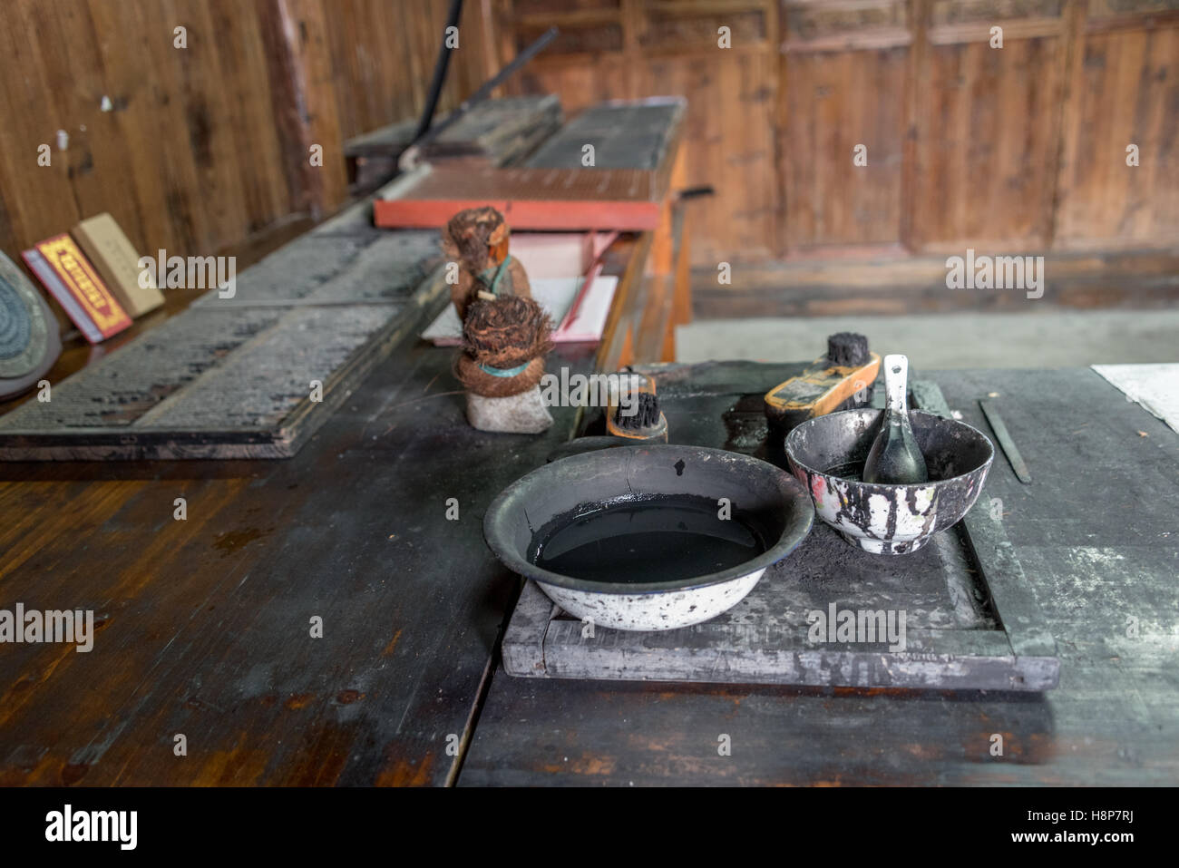 Tools of the trade, Chinese movable wooden type printing ink + brushes at Dongyuan Village, Ruian City, Zhejiang Province, China Stock Photo