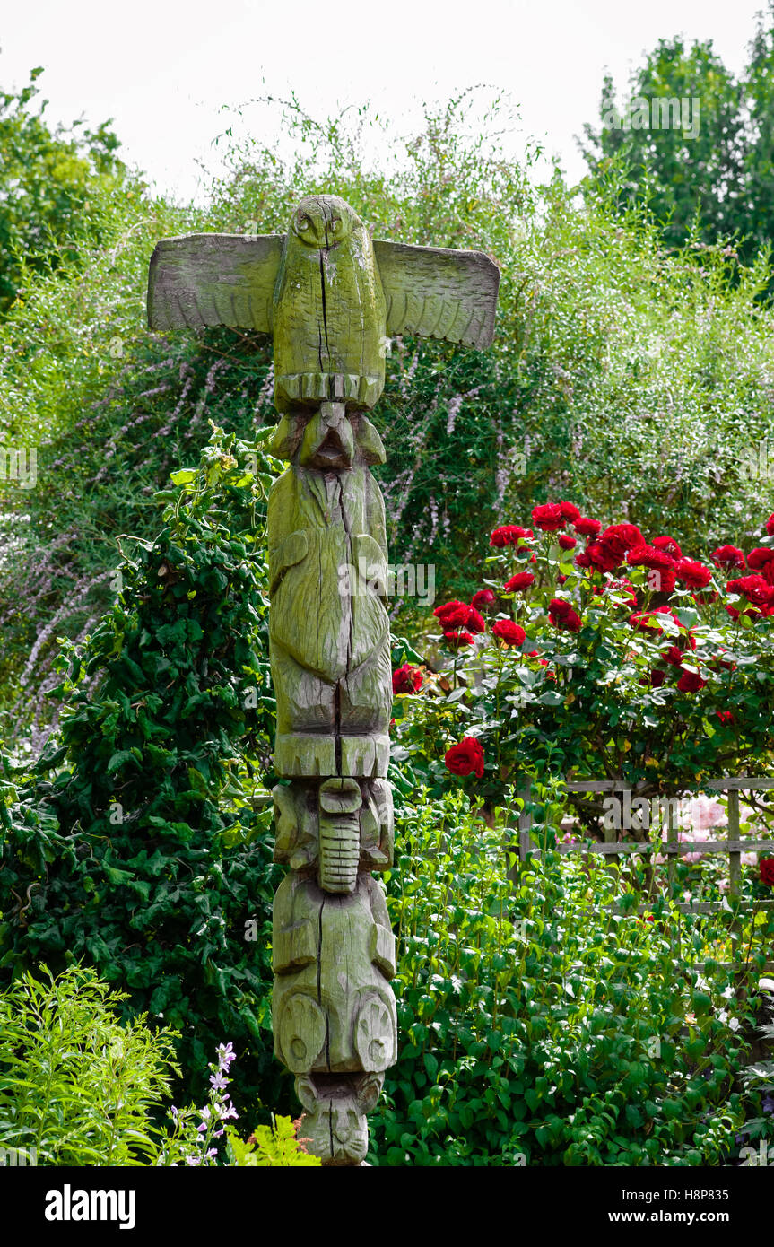 Decorative garden sculpture weathered wood outdoors in natural setting Stock Photo