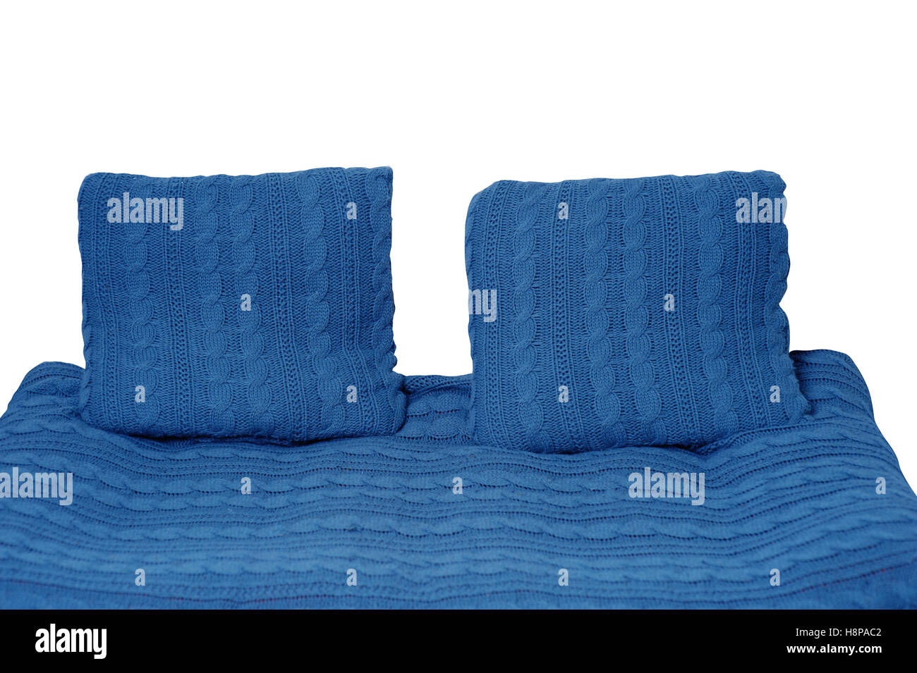 sofa and two pillows in blue isolated on white background Stock Photo
