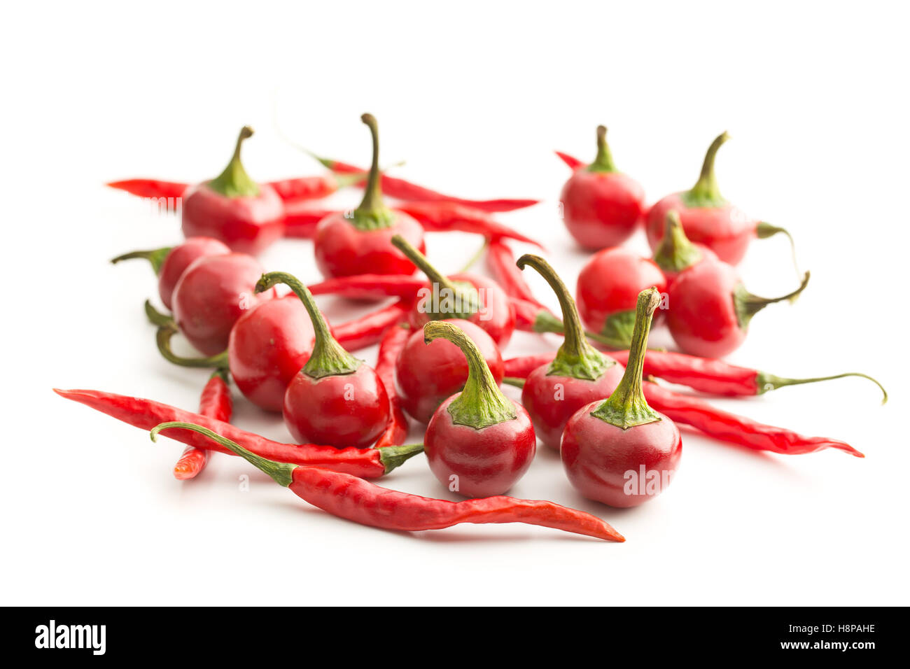 Red chili peppers isolated on white background Stock Photo - Alamy