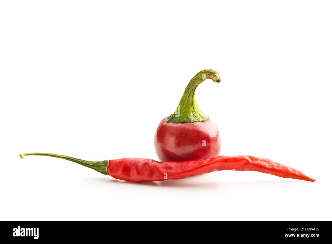Red chili peppers isolated on white background Stock Photo - Alamy