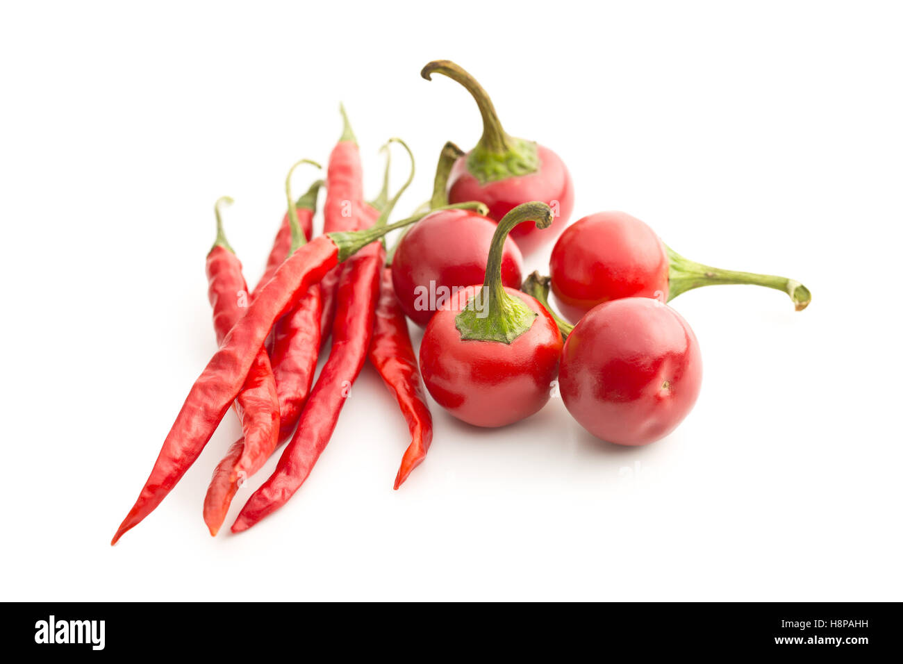 Red chili peppers isolated on white background Stock Photo - Alamy