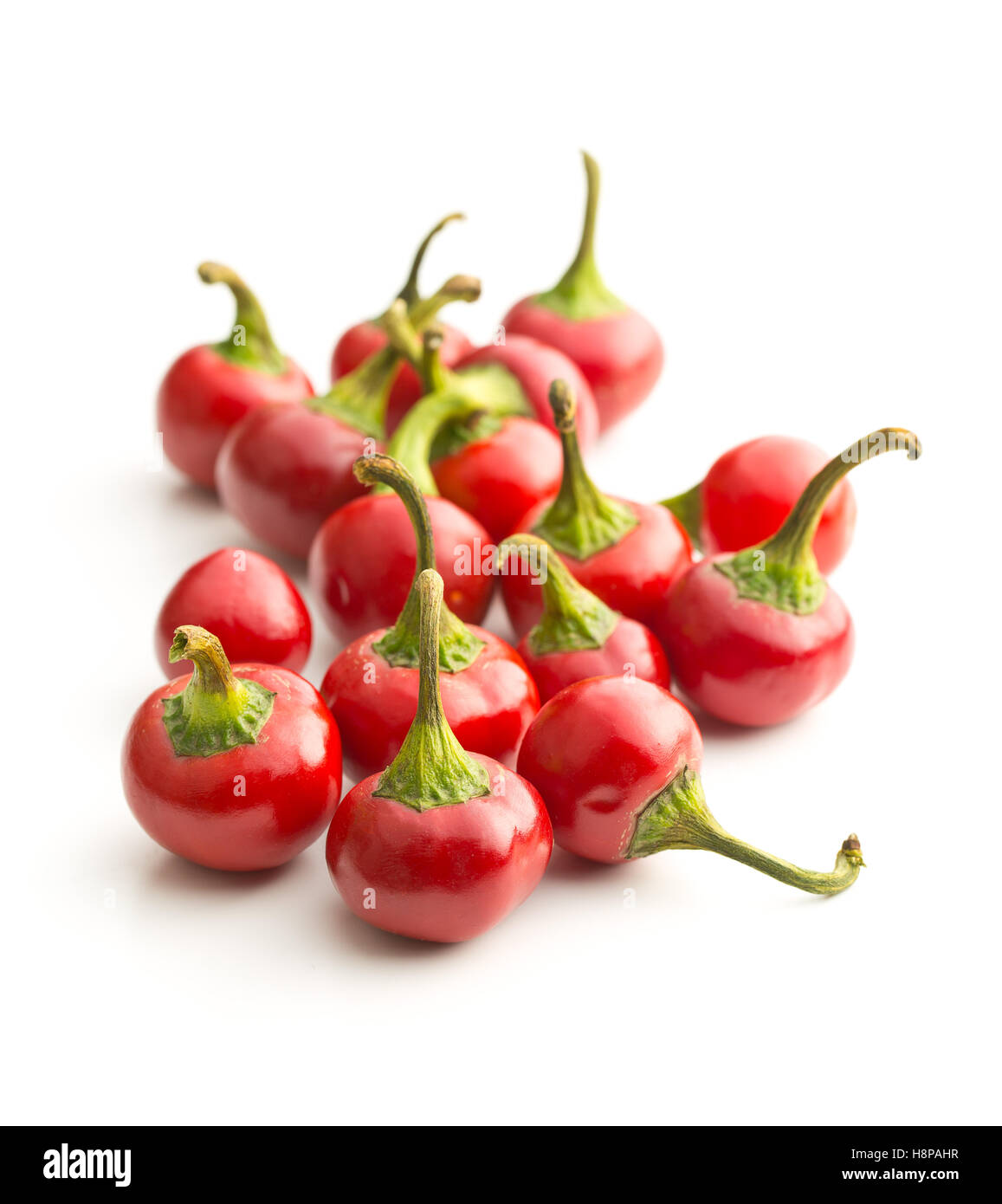 Round chili peppers isolated on white background. Stock Photo