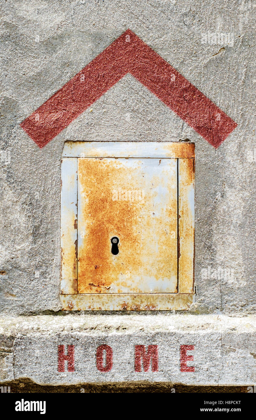 Small metallic door as a concept of home. House symbol sign. Stock Photo