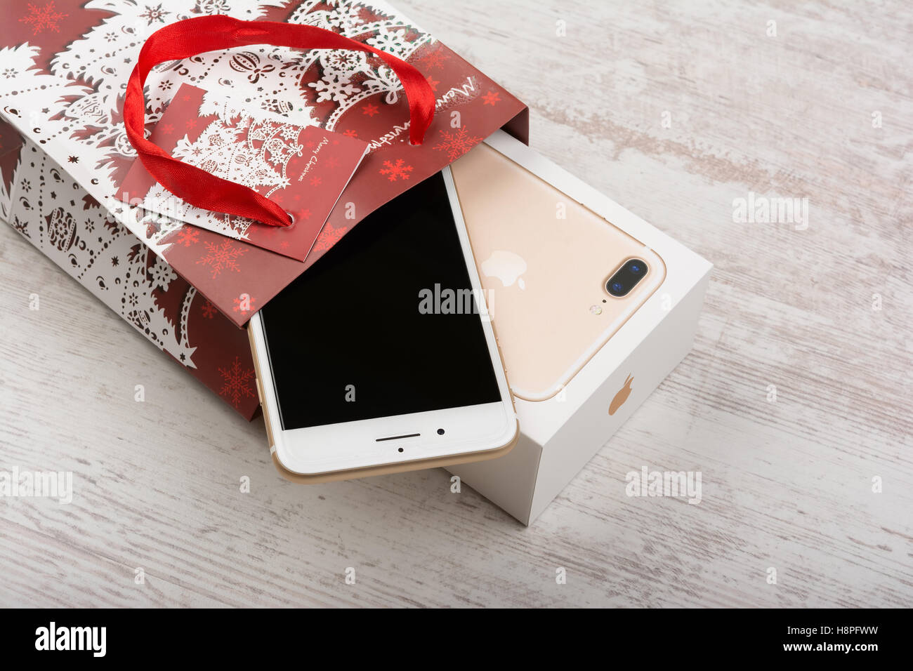 BURGAS, BULGARIA - OCTOBER 22, 2016: New Apple iPhone 7 Plus Gold on white background, Christmas gift, illustrative editorial. Stock Photo
