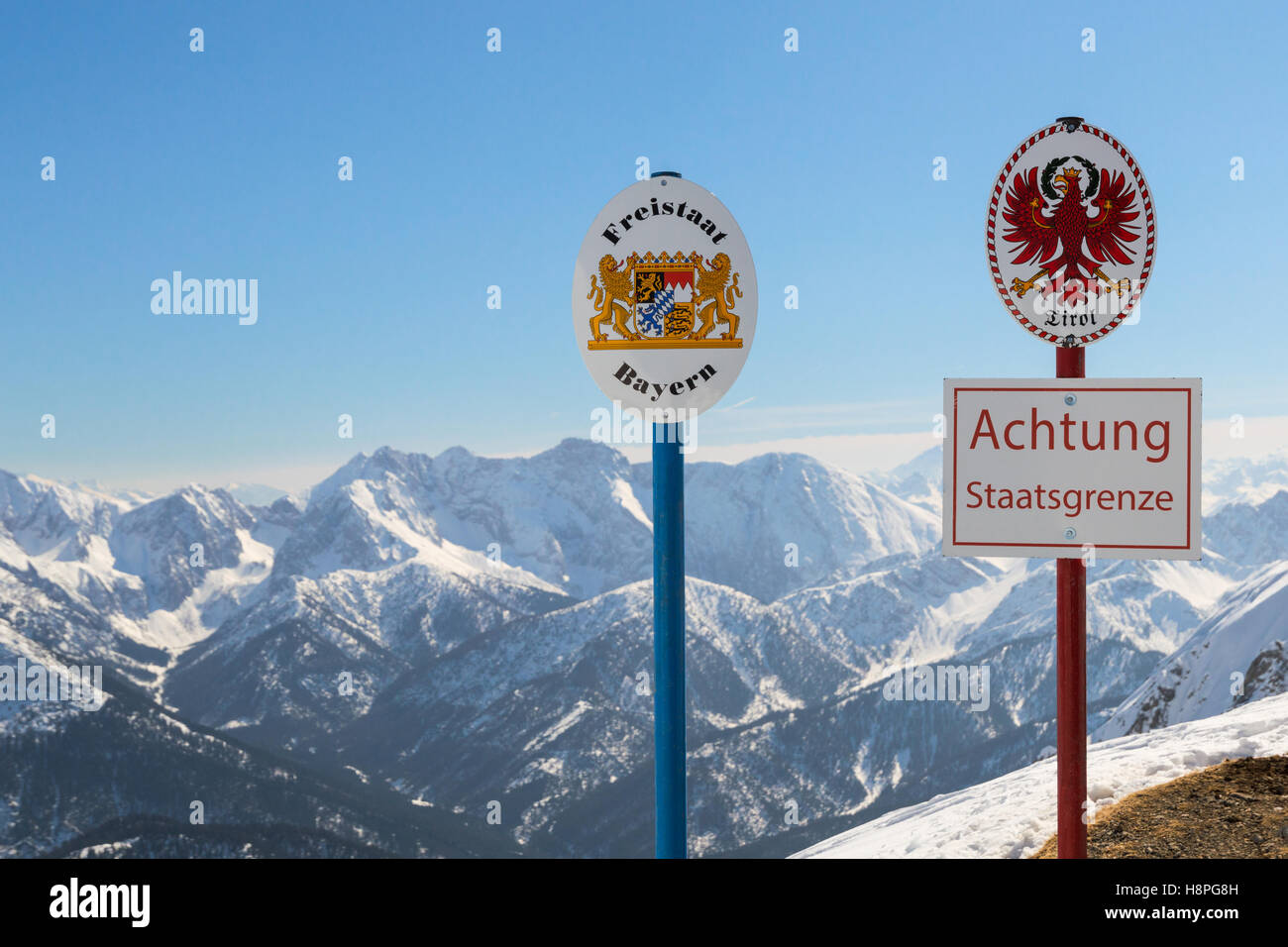 State boundary between Germany and Austria on top of Alpine mountain ridge Stock Photo