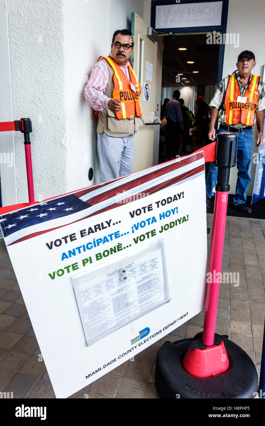 Miami Beach Florida,polling place,station,presidential elections,early voting,multi multiple languages English Spanish Creole,poll deputies,Hispanic a Stock Photo