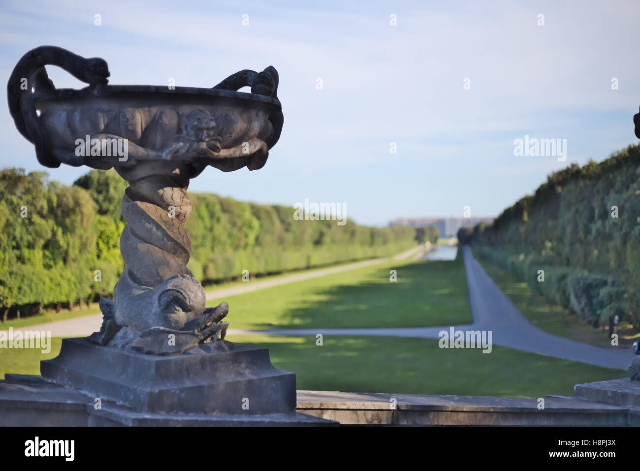 Detail of marble sculpture. Royal Palace of Caserta (Park) on the background Stock Photo