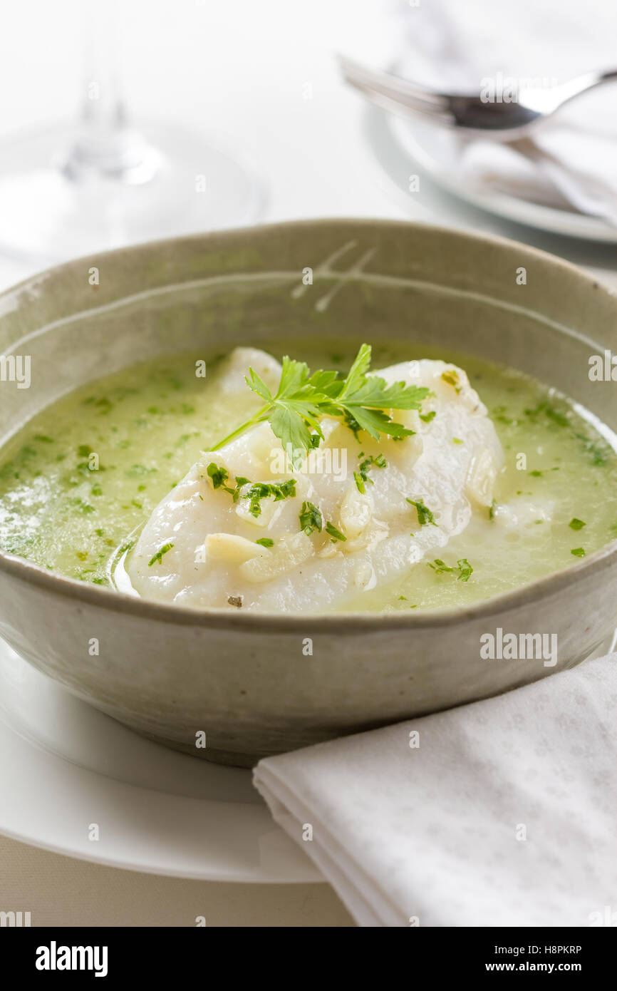 Bacalao en aceite, cod fish dish from the basque region in Spain. Prepared with dried cod, garlic, chili pepper and olive oil Stock Photo