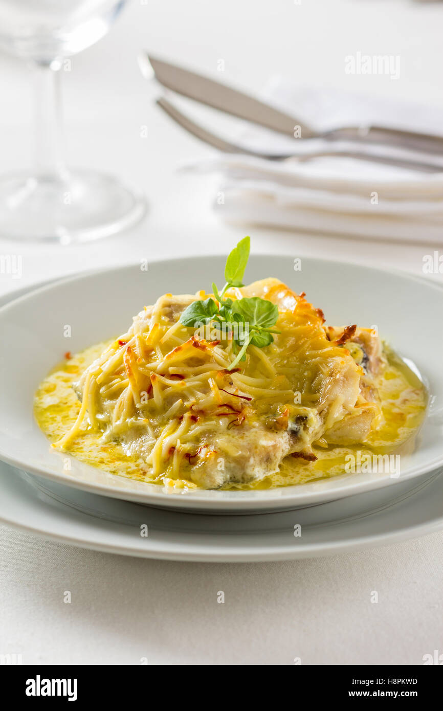 A beautiful dish of sea bass fillet, covered with a saffron sauce Stock