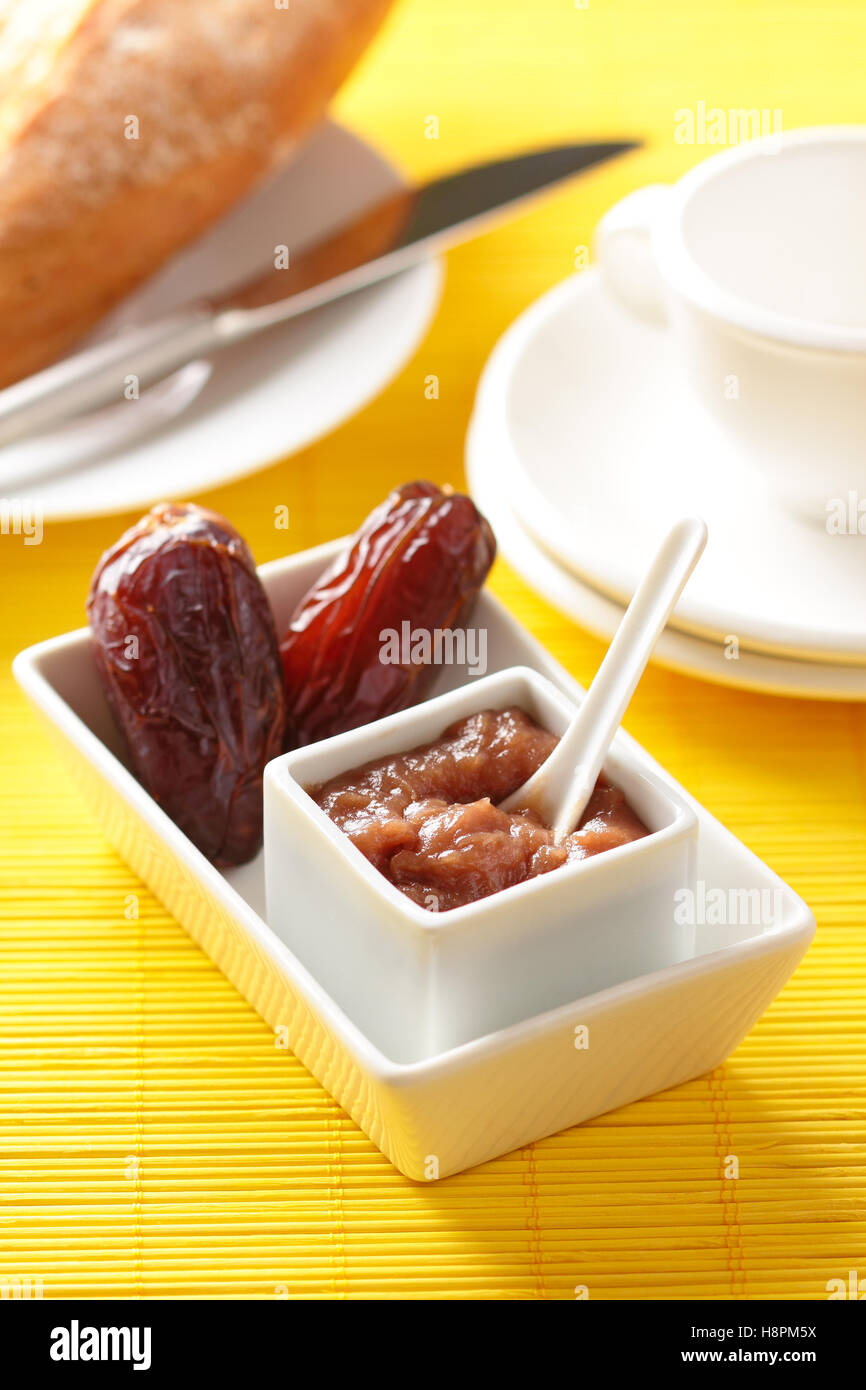 Homemade banana and plum jelly on a breakfast table. Stock Photo