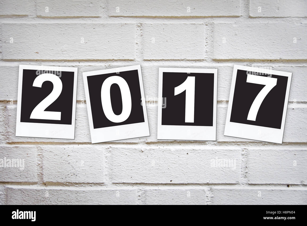 2017 in instant photo frames on a brick wall Stock Photo