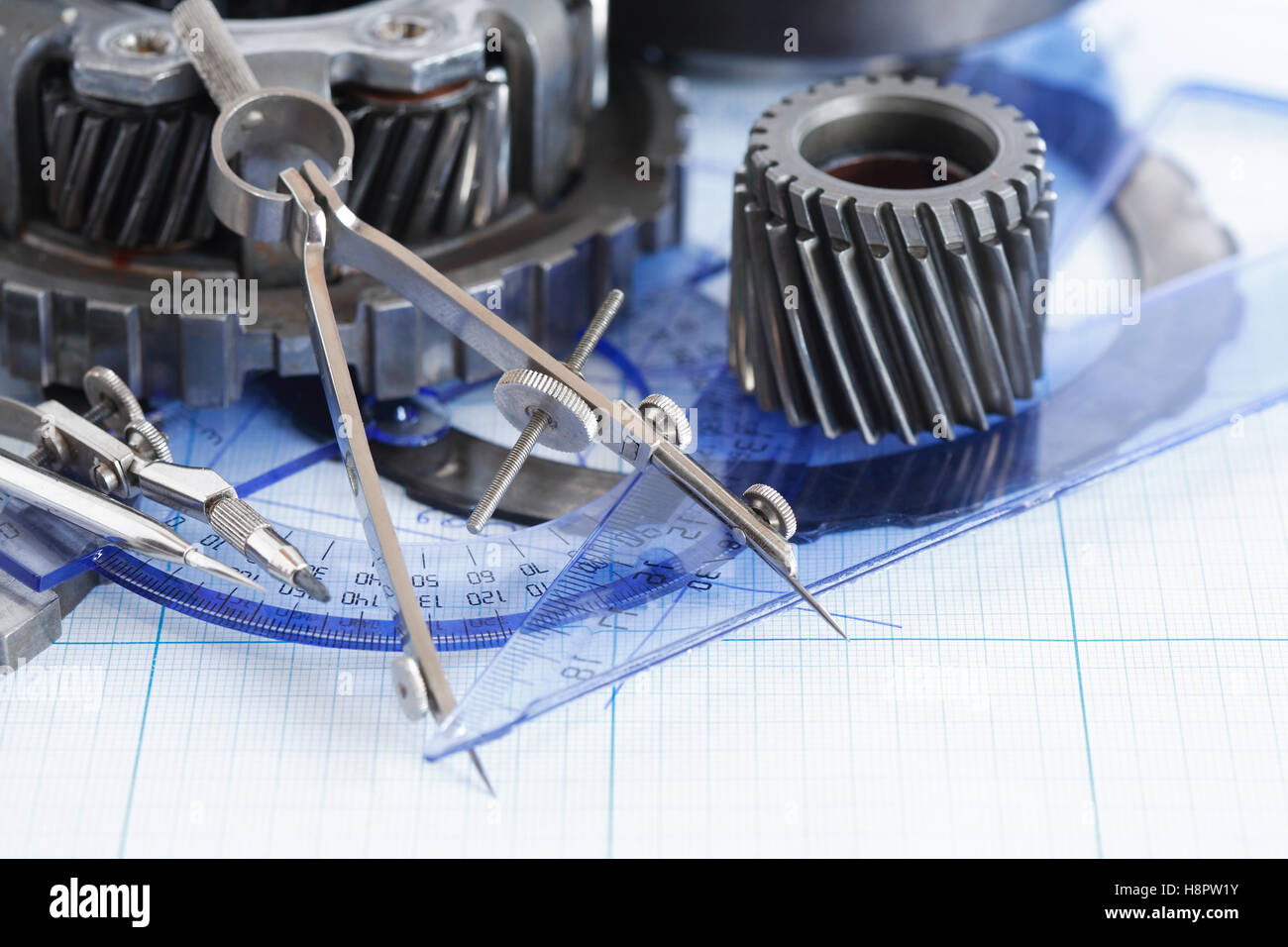 Engineering concept. Set of gears near divider on blueprint Stock Photo ...