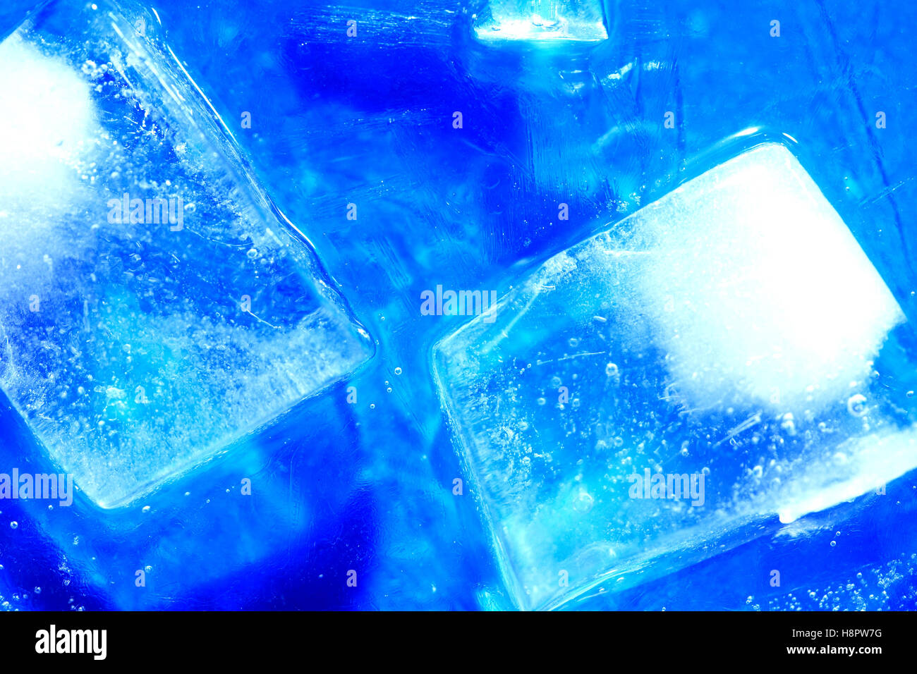 Blue frozen water surface with ice cubes Stock Photo