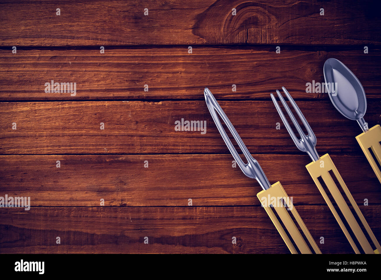 Composite image of plastic knife, fork and spoon Stock Photo