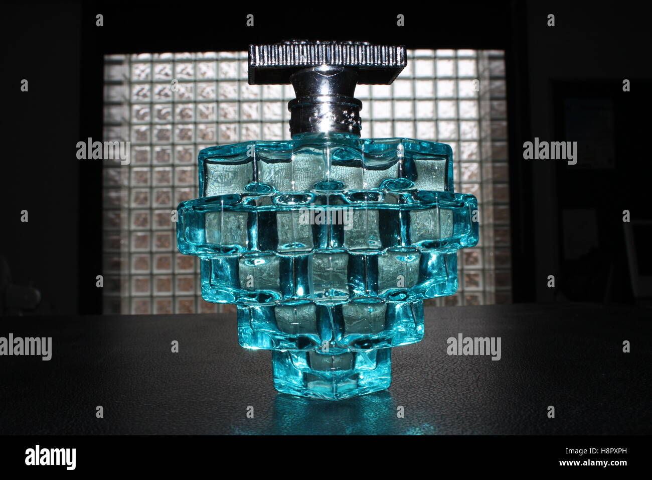Blue glass perfume bottle Stock Photo