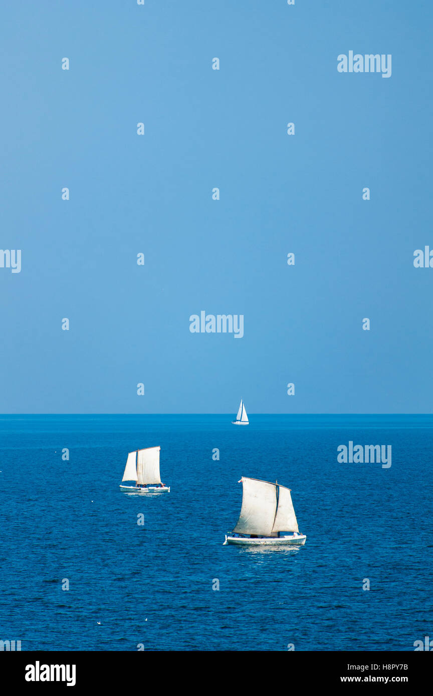Sailboats sailing on deep blue sea and sky Stock Photo - Alamy
