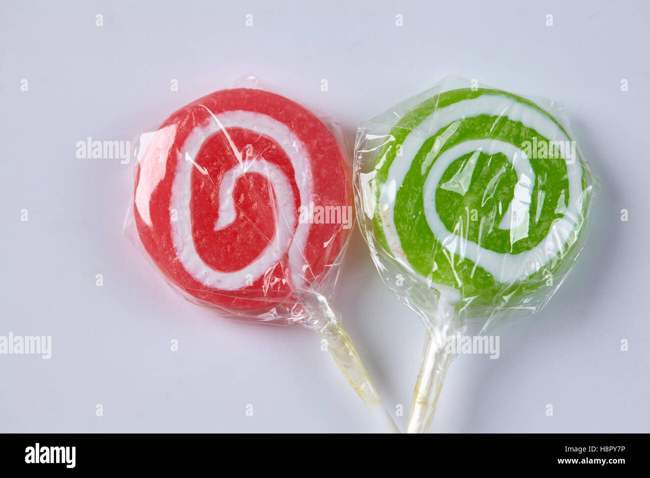 candy on a stick on a white background Stock Photo - Alamy