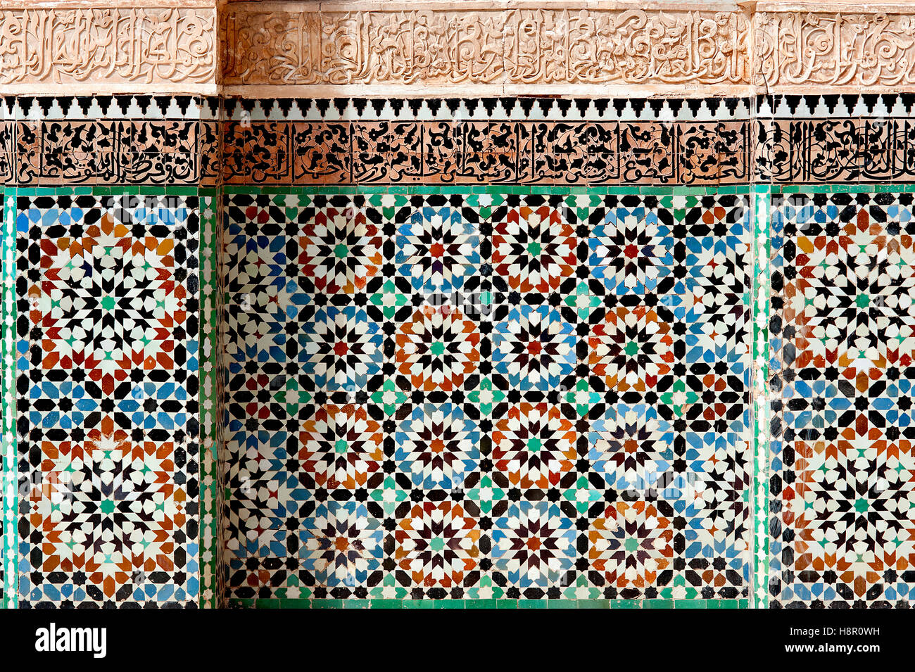 Ben Youssef 'madrasa', Marrakesh, Morocco: colorful mosaics and calligraphy adorn the walls of the Ben Youssef Islamic college. Stock Photo